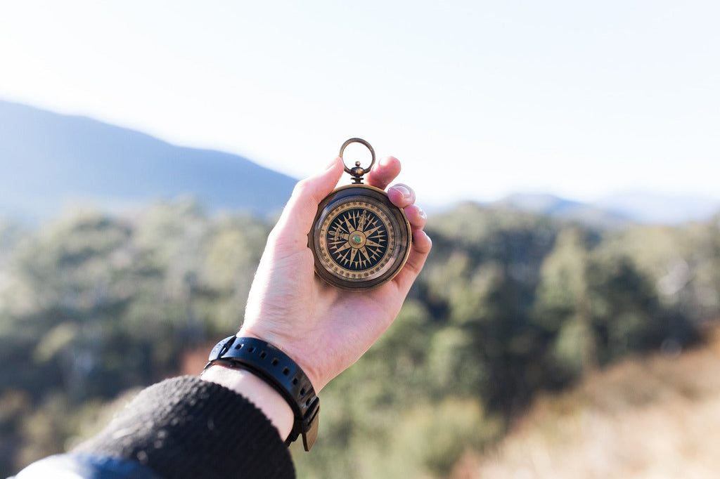 hand with compass symbolizing how keyword search volume data can make you lose out on search traffic