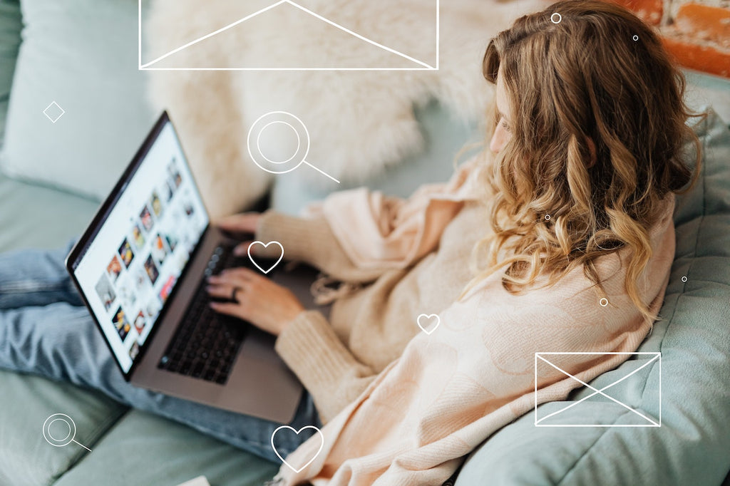 person sitting on a couch with laptop
