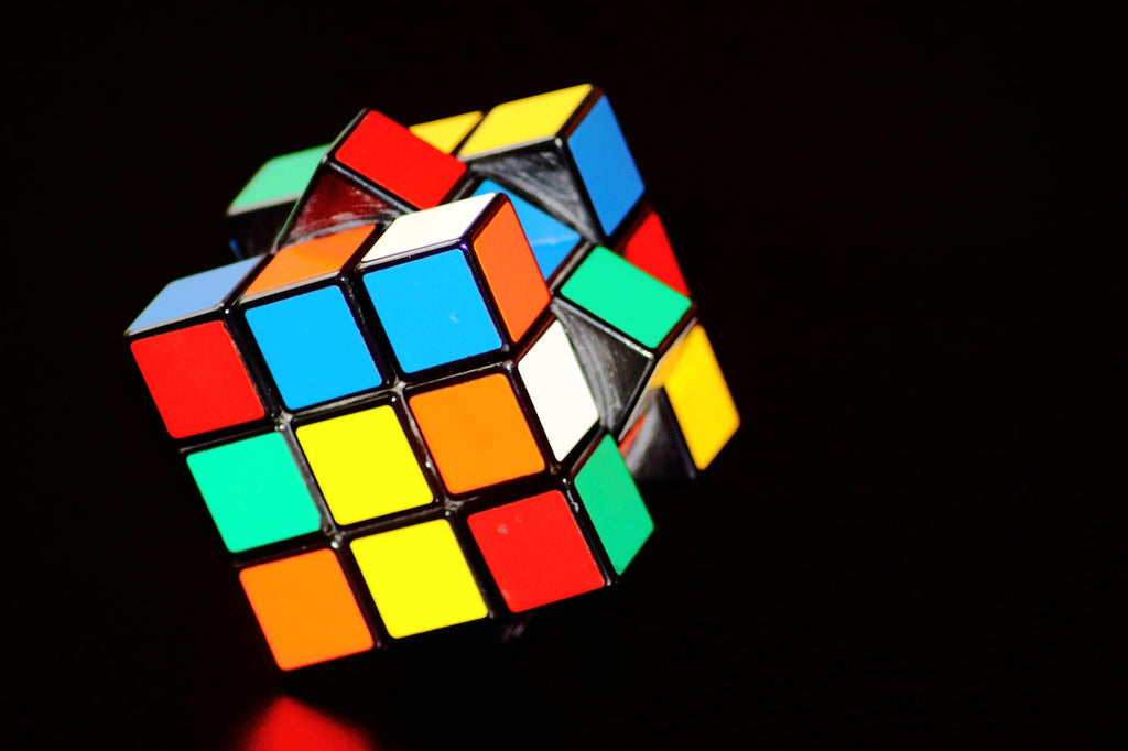 unfinished rubiks cube falling to the floor
