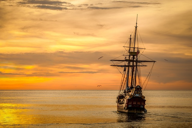 ship against a sunset symbolizing how its important to monitor your amazon seller account and seller agreement